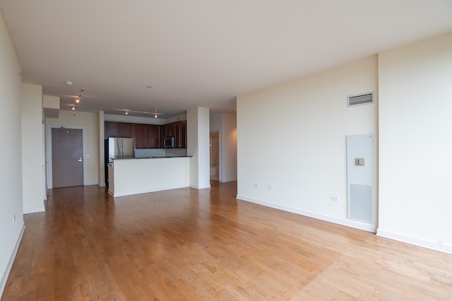 unfurnished living room with light wood-type flooring