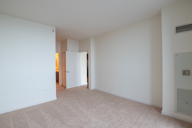 empty room featuring light carpet