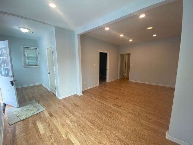 spare room featuring light wood-type flooring