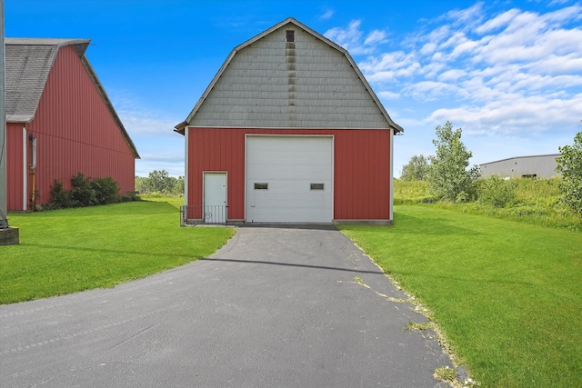 garage with a yard