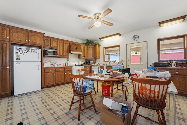 kitchen featuring white appliances and ceiling fan