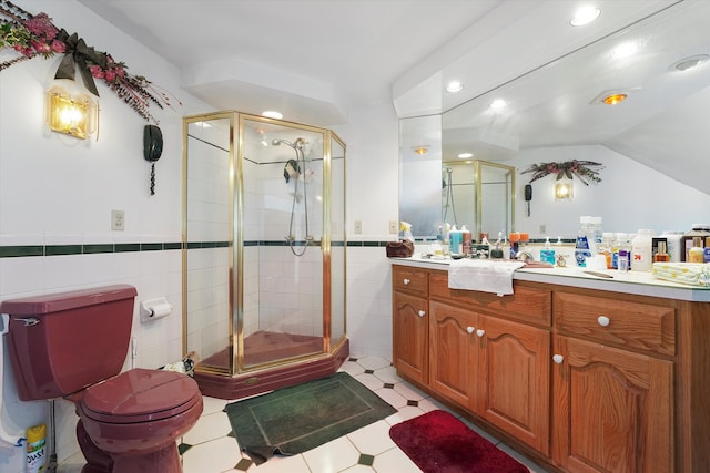 bathroom with walk in shower, vanity, tile walls, and toilet