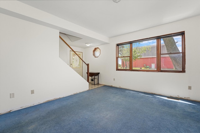 unfurnished room featuring carpet flooring