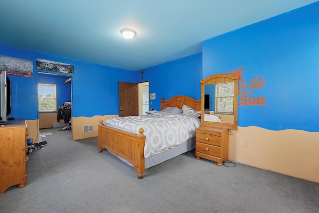 bedroom with light colored carpet