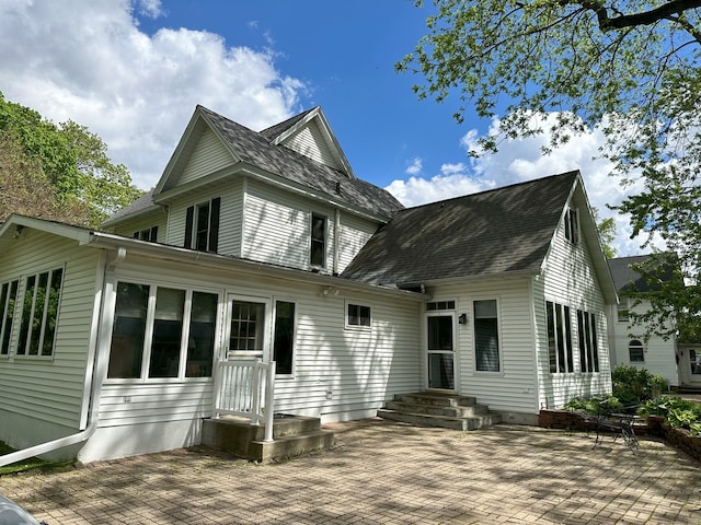 rear view of house featuring a patio