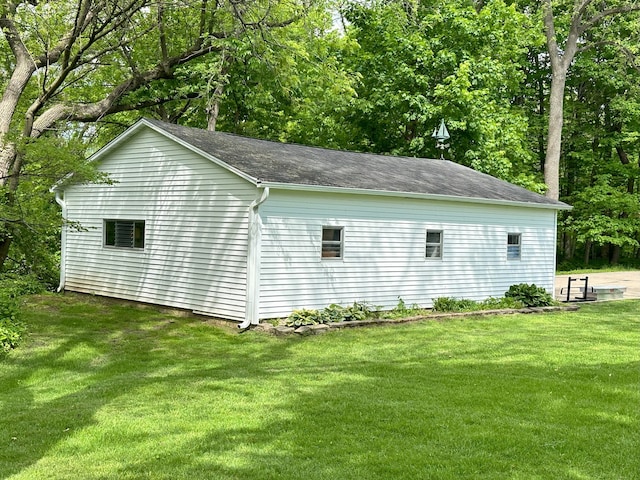 view of property exterior featuring a lawn