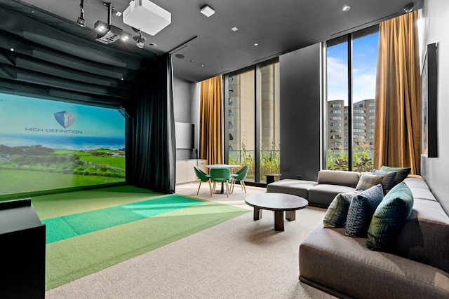 game room featuring floor to ceiling windows, golf simulator, and carpet floors