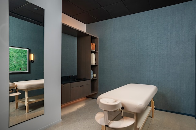 bathroom with sink and a paneled ceiling