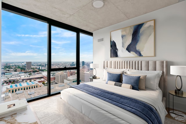 bedroom featuring floor to ceiling windows