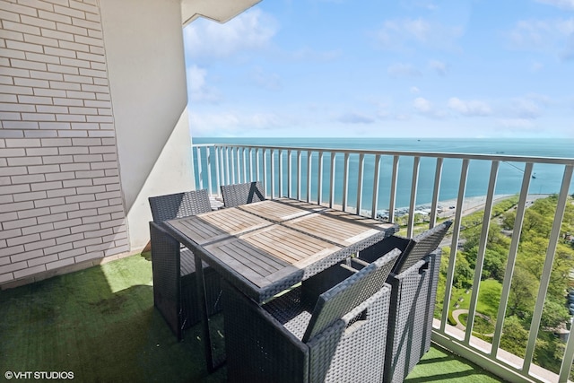 balcony featuring a water view