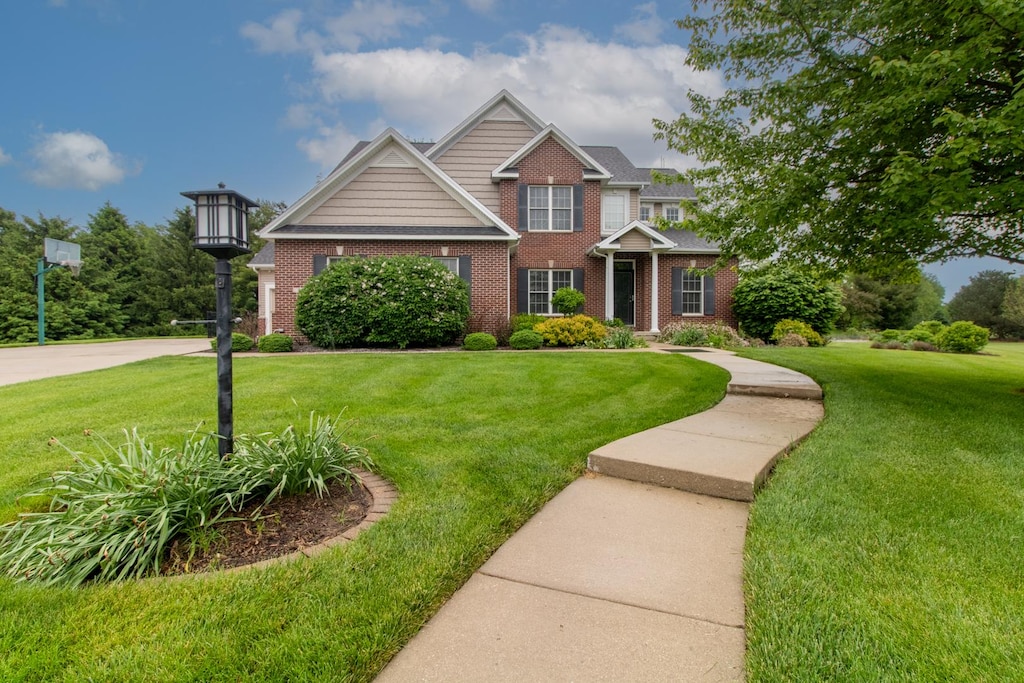 craftsman-style home with a front yard