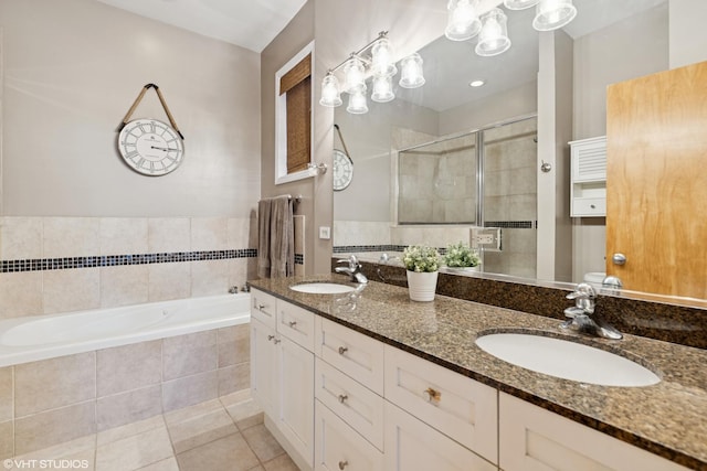 1646 W Augusta Blvd Unit 1, Chicago, IL 60622 - full bath with a stall shower, a garden tub, tile patterned floors, and double vanity