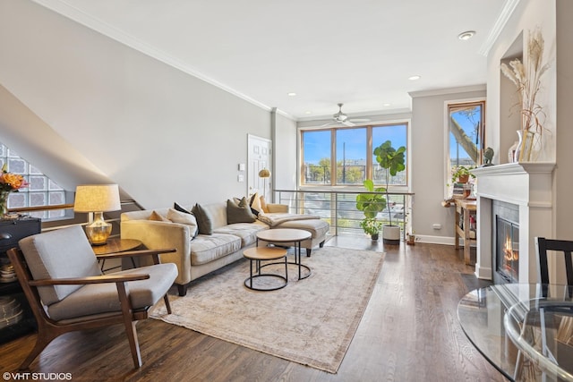 1646 W Augusta Blvd Unit 1, Chicago, IL 60622 - living room featuring plenty of natural light, a fireplace with flush hearth, crown molding, a ceiling fan, and dark wood-style flooring