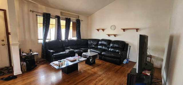 living room with dark hardwood / wood-style flooring and vaulted ceiling