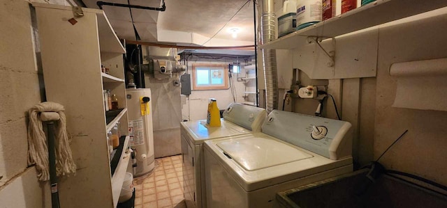 washroom with washing machine and dryer, water heater, and light tile floors