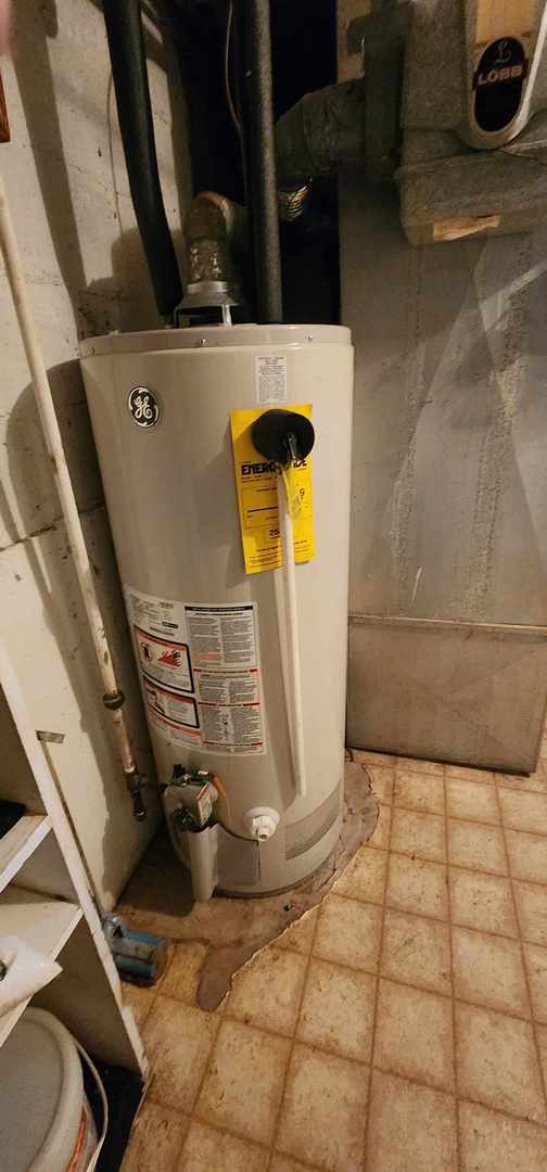 utility room with water heater