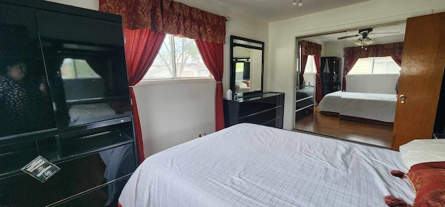 bedroom featuring hardwood / wood-style floors and a closet