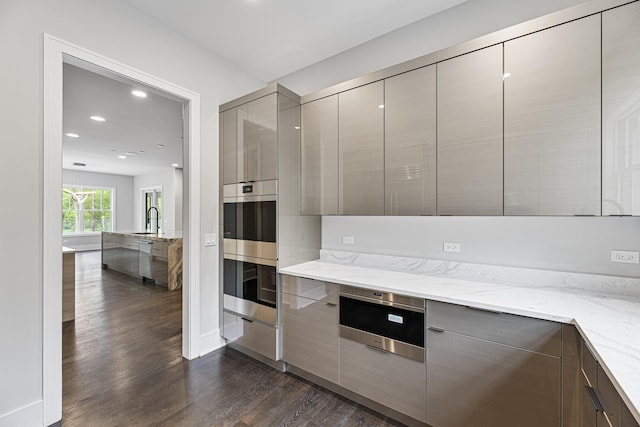 213 Northampton Ln, Lincolnshire, IL 60069 - kitchen with modern cabinets, dark wood-type flooring, stainless steel appliances, and recessed lighting