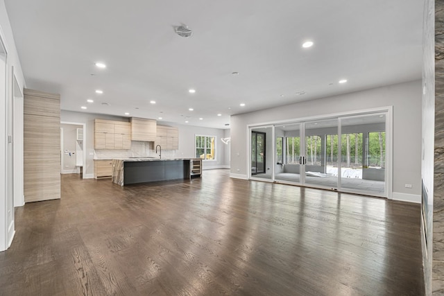 213 Northampton Ln, Lincolnshire, IL 60069 - unfurnished living room featuring recessed lighting, a sink, baseboards, and dark wood-type flooring