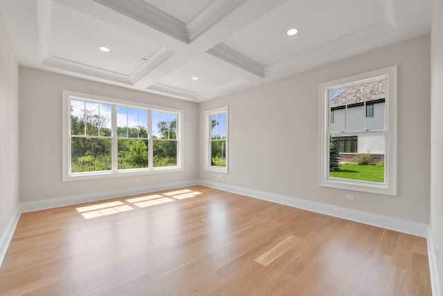 empty room featuring beamed ceiling, baseboards, light wood-style floors, and coffered ceiling