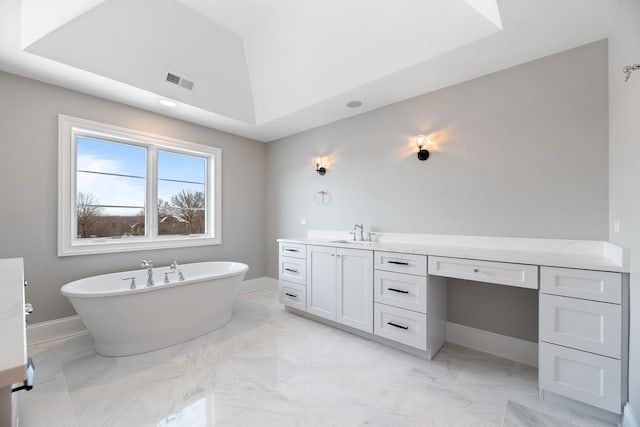 213 Northampton Ln, Lincolnshire, IL 60069 - bathroom featuring marble finish flooring, a soaking tub, baseboards, and vanity