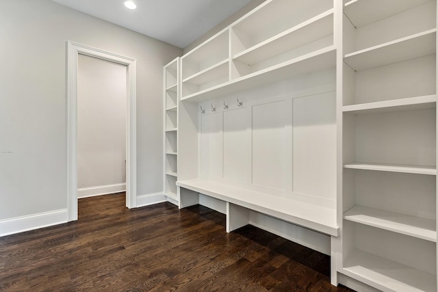mudroom featuring dark wood finished floors, baseboards, and recessed lighting
