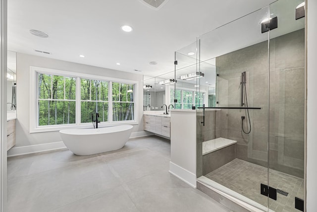 213 Northampton Ln, Lincolnshire, IL 60069 - bathroom with baseboards, vanity, a stall shower, a freestanding tub, and recessed lighting