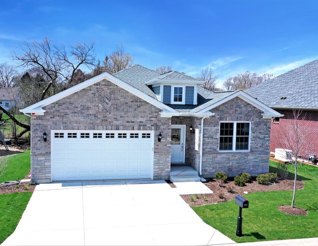 craftsman house with a garage and a front lawn