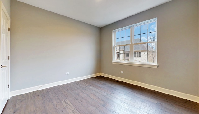 empty room featuring hardwood / wood-style flooring