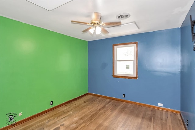 unfurnished room featuring hardwood / wood-style floors and ceiling fan