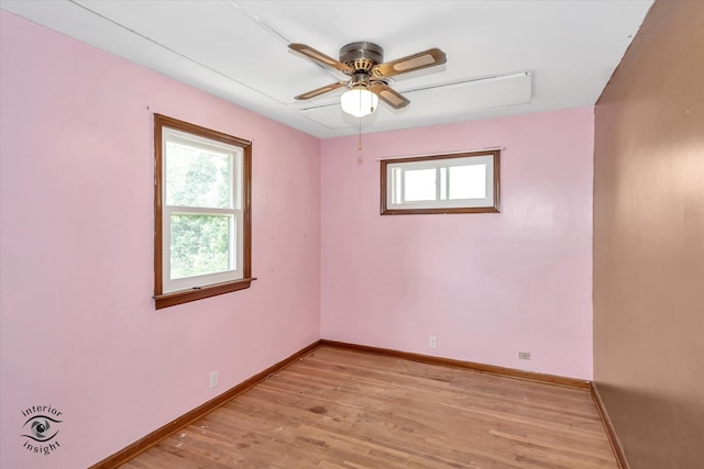 empty room featuring ceiling fan and hardwood / wood-style flooring