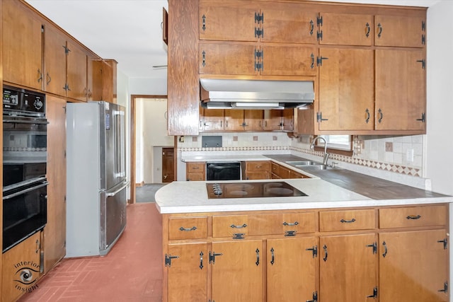 kitchen with sink, backsplash, and black appliances