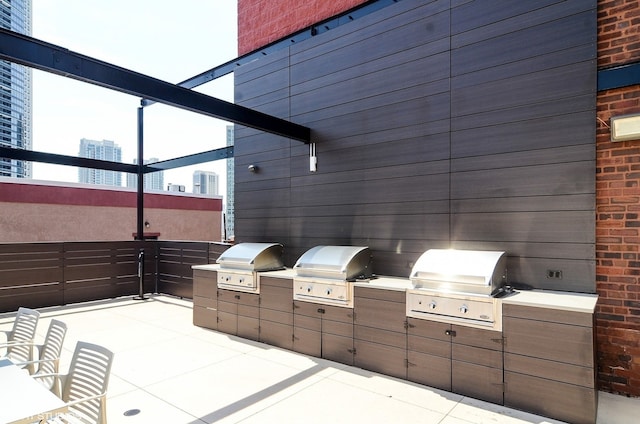 view of patio featuring an outdoor kitchen and area for grilling