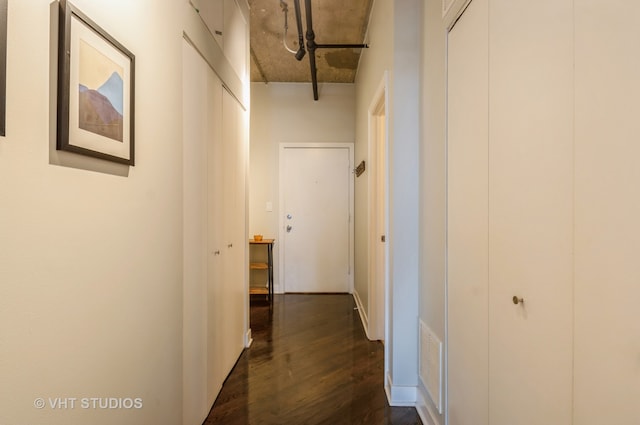 hall with dark hardwood / wood-style floors