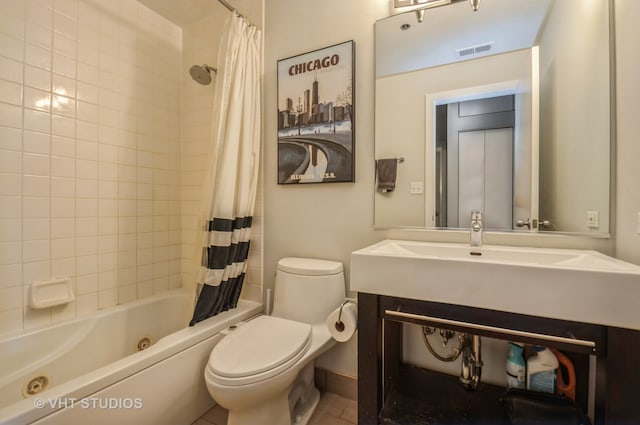 full bathroom with shower / bath combo with shower curtain, vanity, toilet, and tile floors