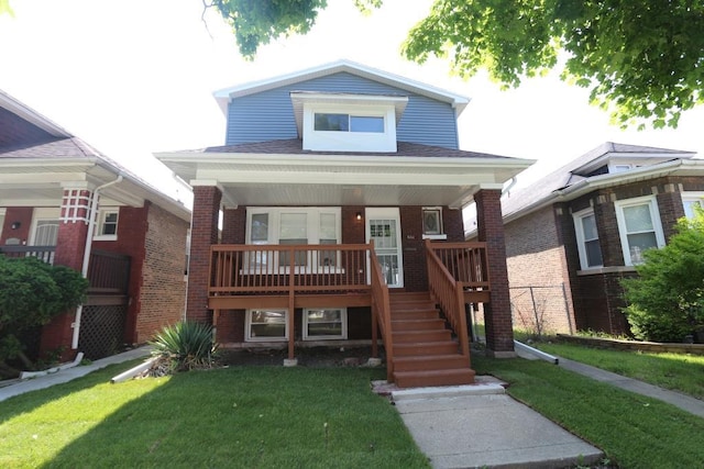 bungalow-style home featuring a front lawn and covered porch