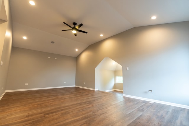 empty room featuring ceiling fan, vaulted ceiling, and hardwood / wood-style flooring