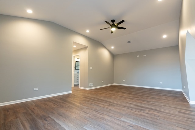 unfurnished room with ceiling fan, hardwood / wood-style floors, and lofted ceiling