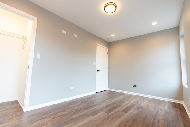 unfurnished room featuring hardwood / wood-style flooring