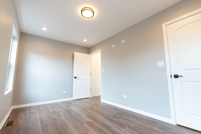 unfurnished room featuring hardwood / wood-style floors