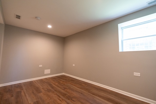 spare room with dark hardwood / wood-style floors