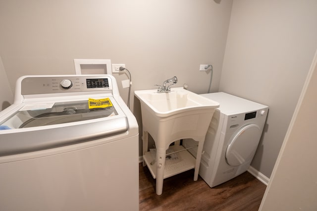 laundry area featuring hookup for a washing machine, hardwood / wood-style floors, and independent washer and dryer