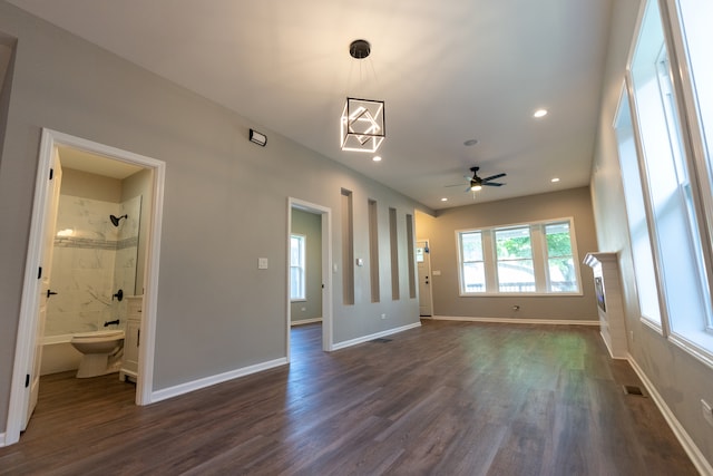 interior space with ceiling fan and dark wood-type flooring