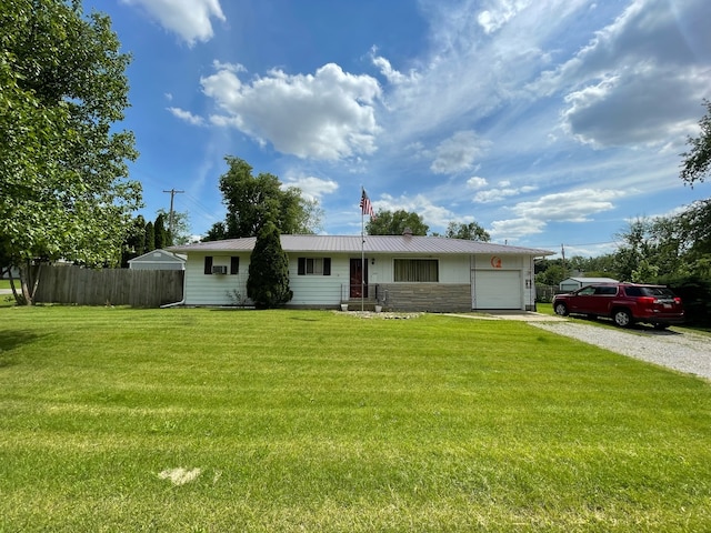 ranch-style home with a garage and a front yard