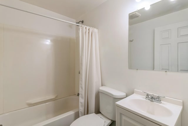 full bathroom with shower / bath combination with curtain, vanity, and toilet