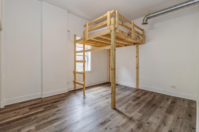 unfurnished bedroom featuring wood-type flooring