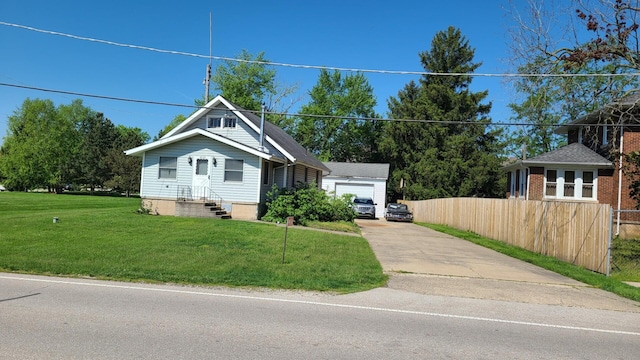 view of front facade with a garage and a front yard