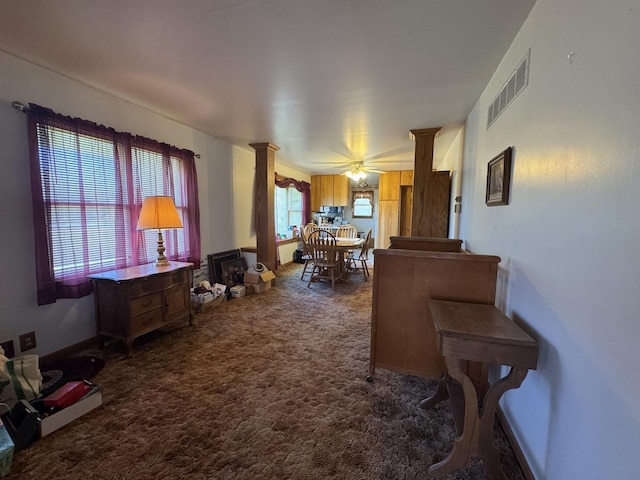04N732 Old Lafox Rd, Saint Charles, IL 60175 - living area with dark carpet, ornate columns, and ceiling fan