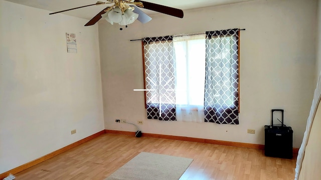 empty room featuring wood-type flooring and ceiling fan