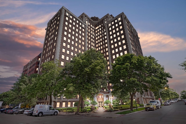 view of outdoor building at dusk